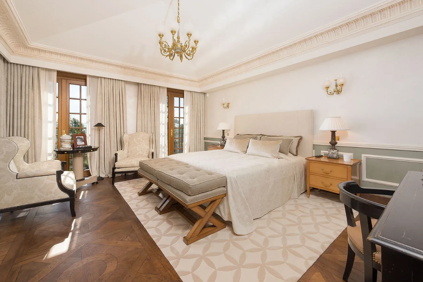 Calm bedroom. Beige on beige with cozy lamp glow.