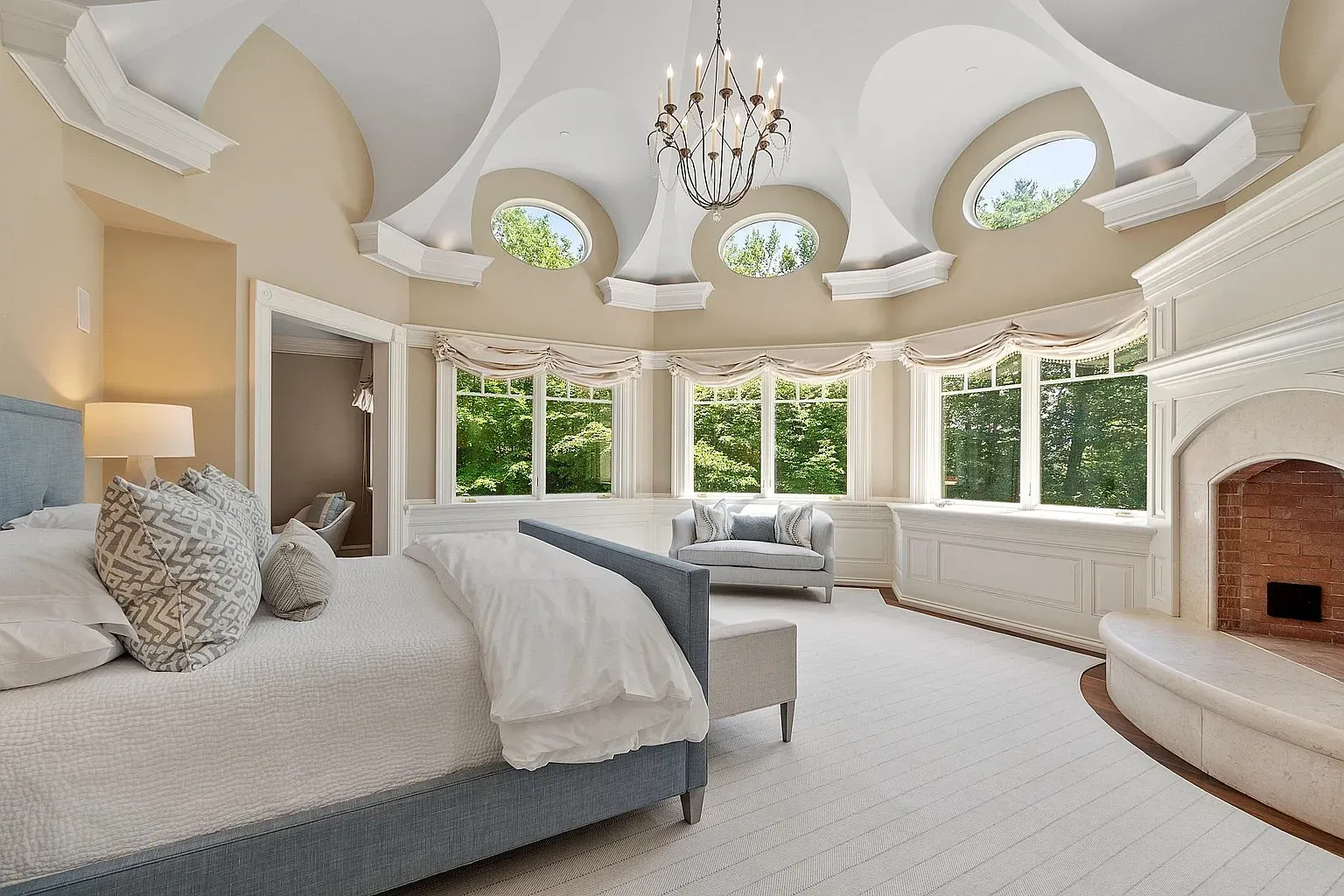 Cathedral ceiling with round skylights—light everywhere, no alarm needed.