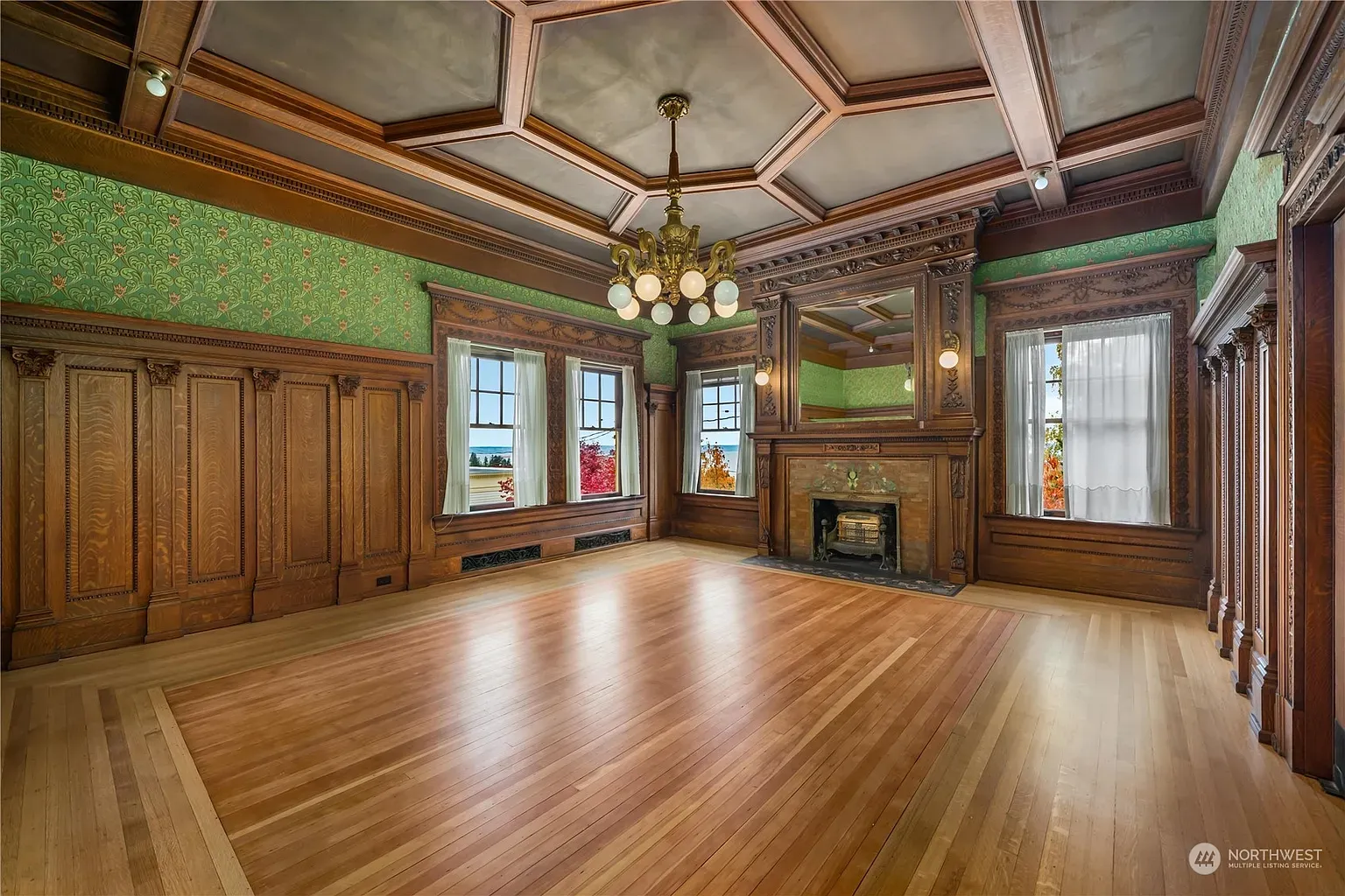 Wood paneling plus bold green floral paper. Old-school and kind of awesome.