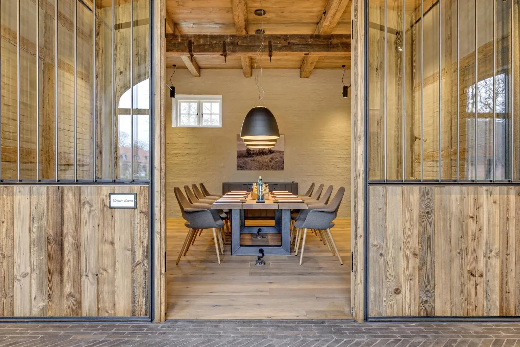 Glass doors slide open to a wood-heavy dining spot. Feels easy.