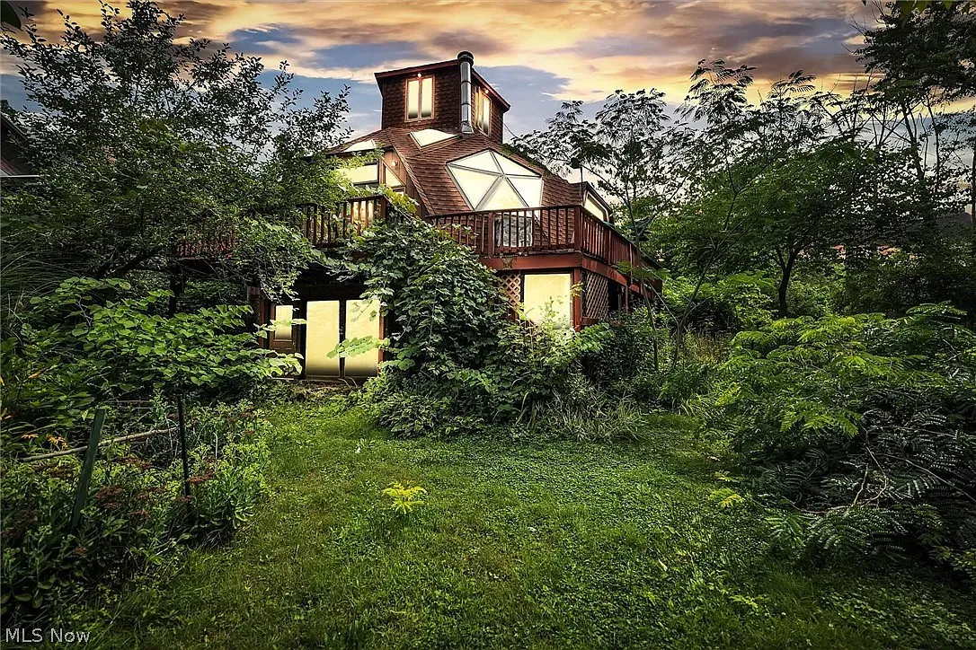 Forest fortress vibes, with triangular windows and a random little turret.