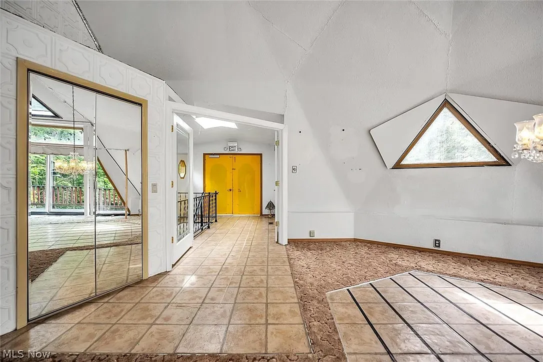 Vaulted ceiling with funky texture. Clean, bright, a little geometric drama.