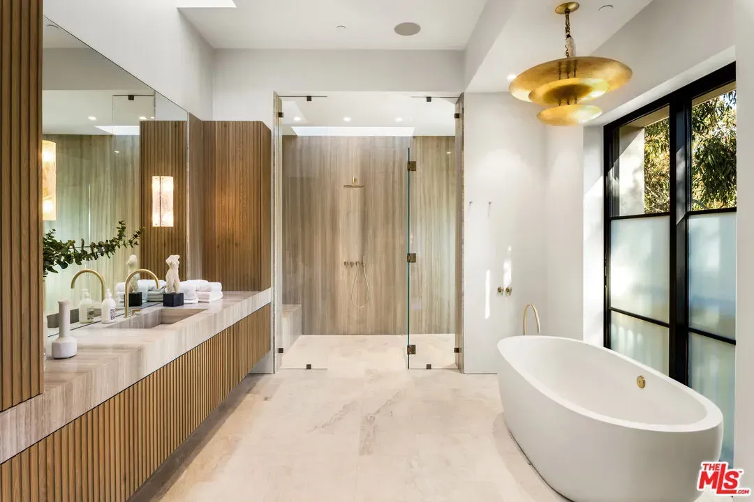 Spa bathroom mood. Oval tub against warm wood planks. Yes please.