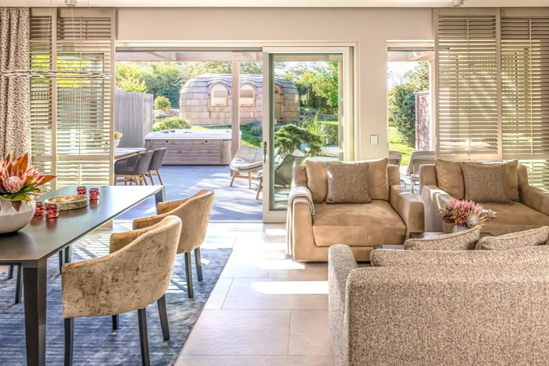 Indoor-outdoor living nailed. Big sliders, soft neutrals, garden right there.