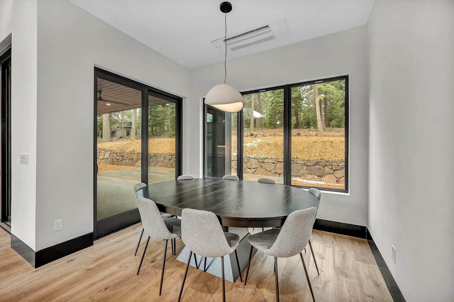 Dinner with the pines as the wallpaper. Those windows are massive.