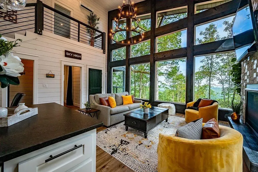 Tall ceilings and those windows stealing the show. Shiplap keeps it bright.
