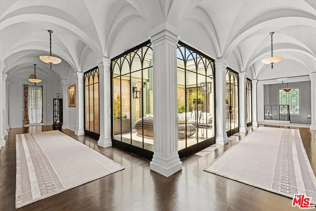 Entry with soaring arches and a detailed ceiling. Dramatic in a good way.
