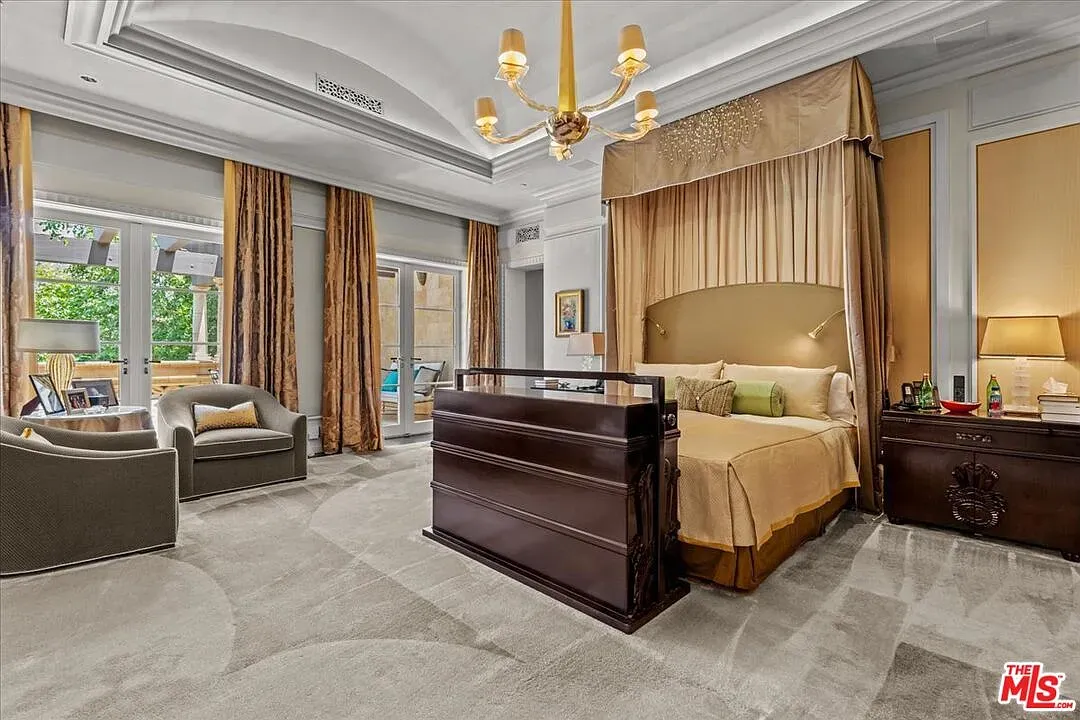 Golden bedroom, plush carpet, chandelier sparkle. Sleep royalty mode.