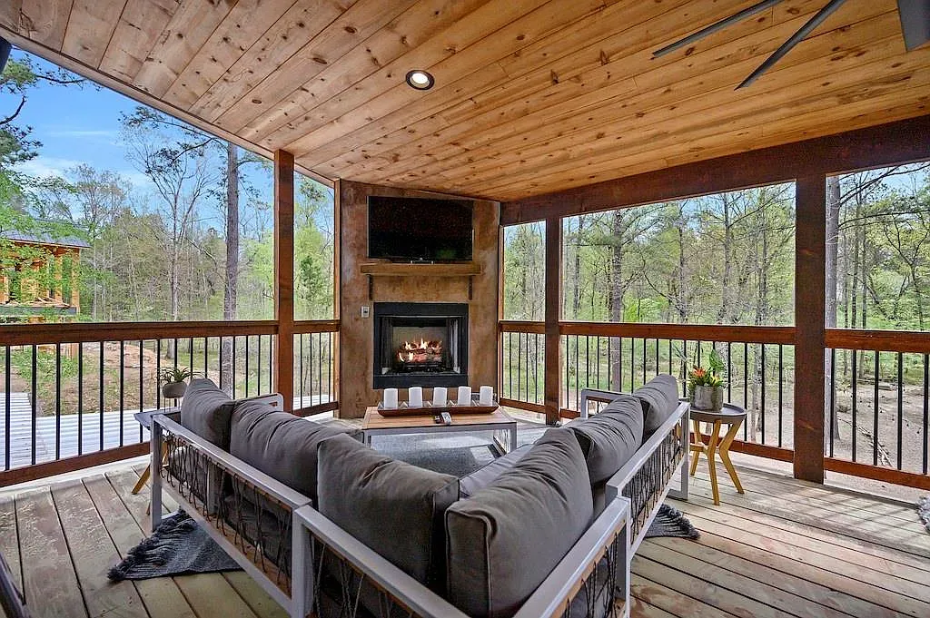 If you love light, this covered porch is basically windows and wood.