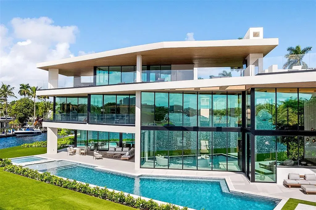 Back outside—stacked glass boxes, soft beige. Resort energy turned up.