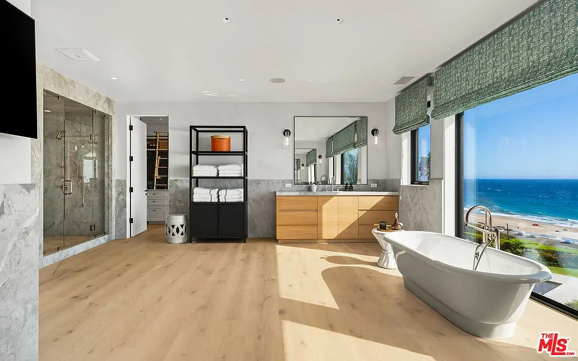 Spa bathroom with full ocean panorama. I’d lose time in that shower or tub.