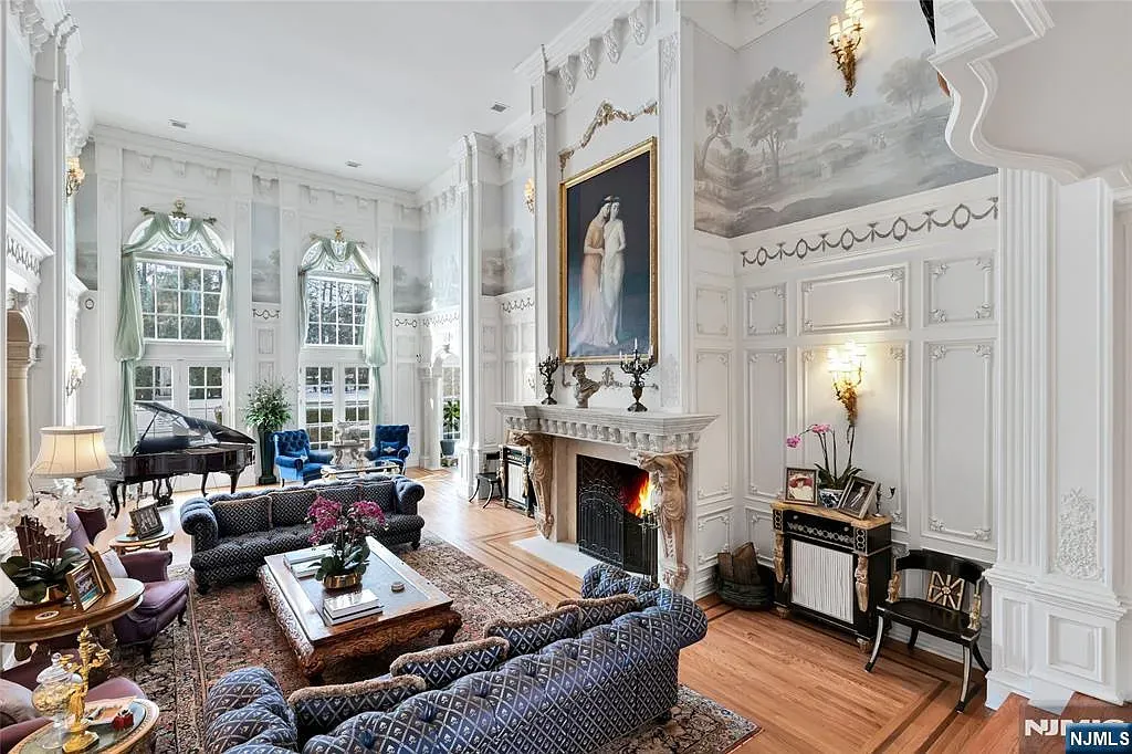 Living room with massive moldings and neutral walls. I mean, gorgeous, maybe a museum?