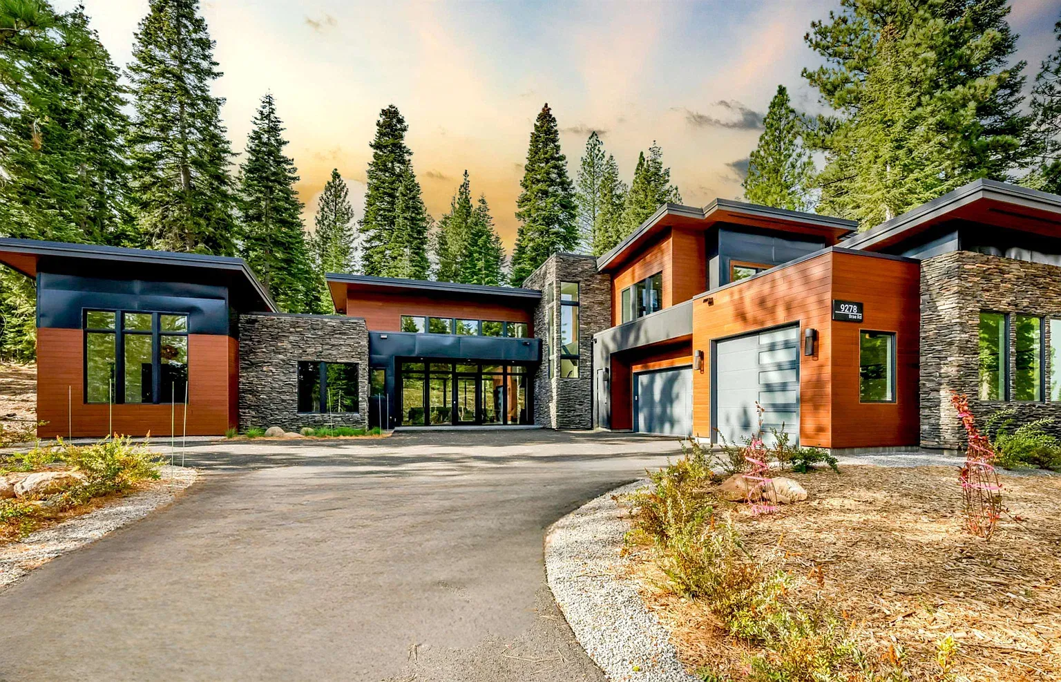 Wood and stone with those black frames—looks sharp against the trees.