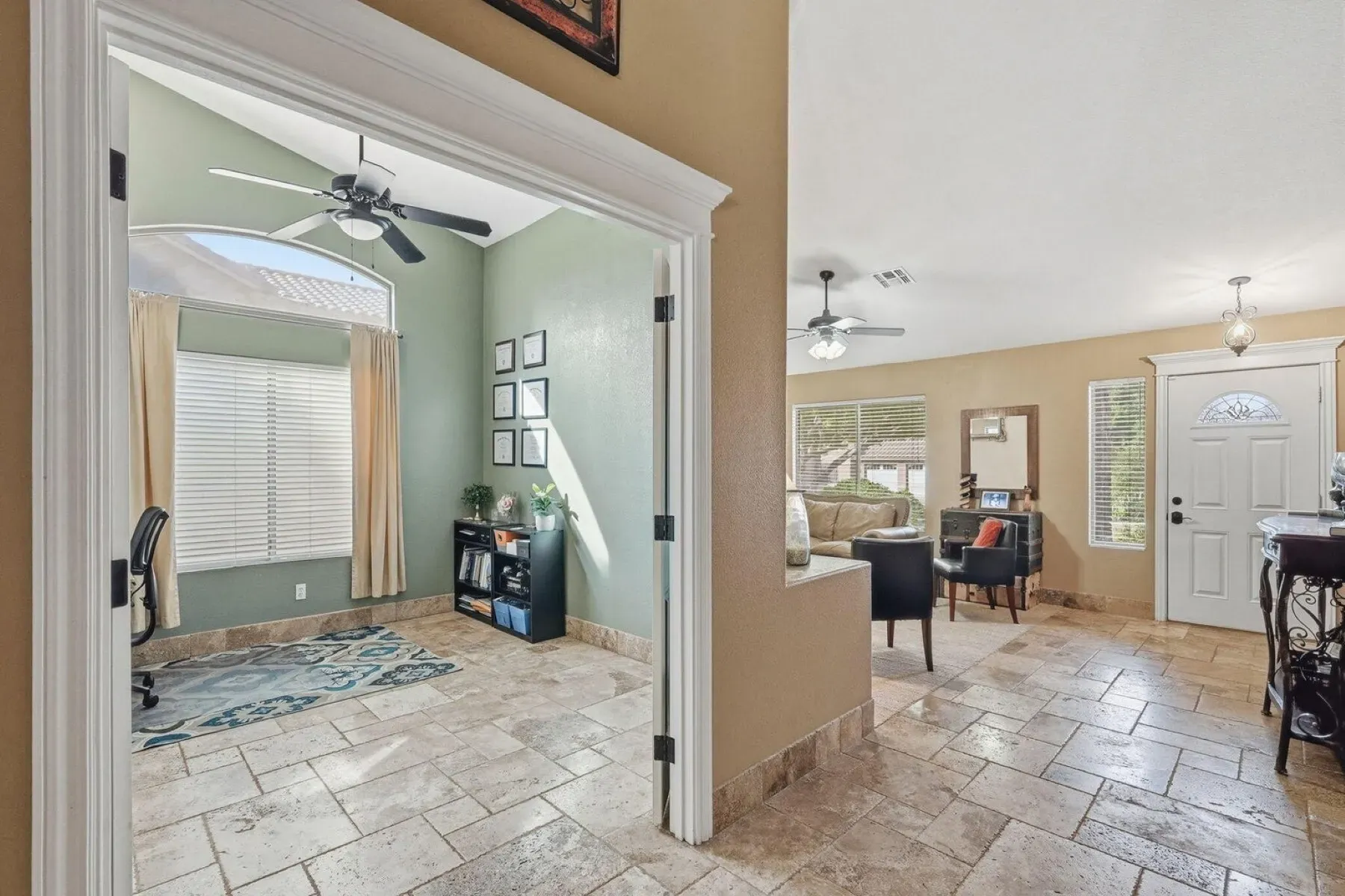 Open layout with a green study tucked left. Nice light everywhere.