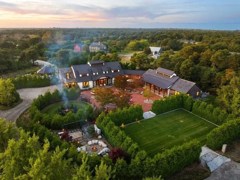Dark roof angles slicing through the trees. Feels tucked in, not flashy.