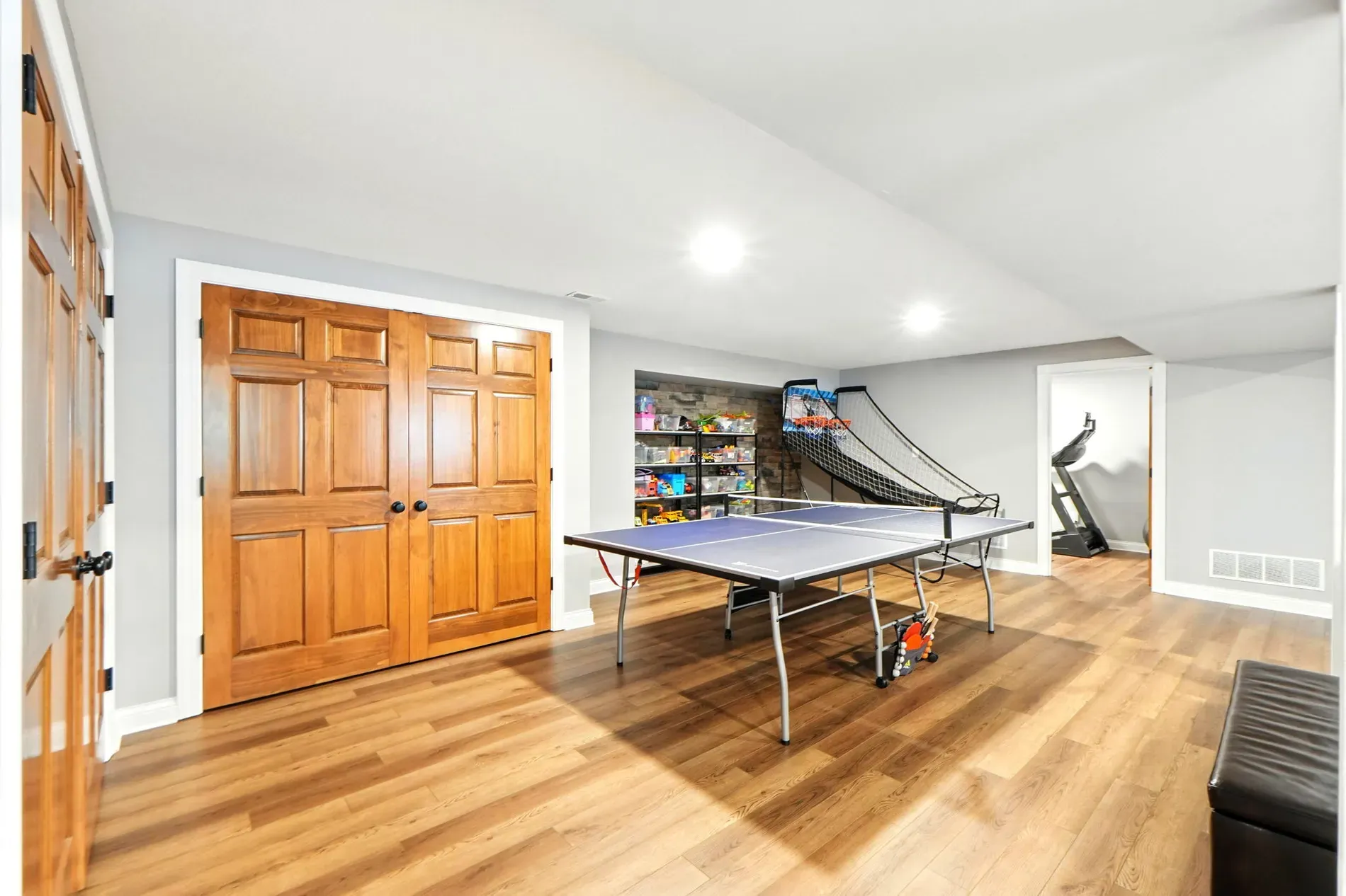 Basement looks finished, finally. Plenty of space for movie nights or chaos.