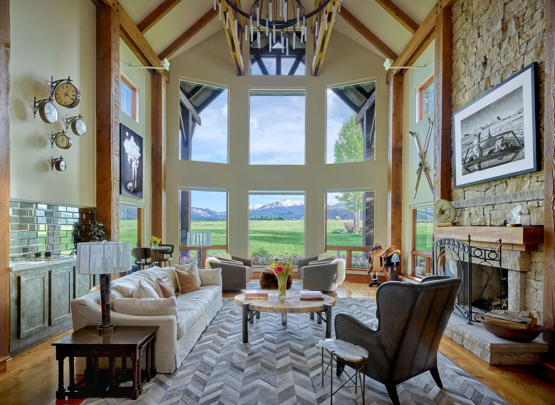 Here's the living room — vaulted beams, big windows, lots of light. Cozy-scale.