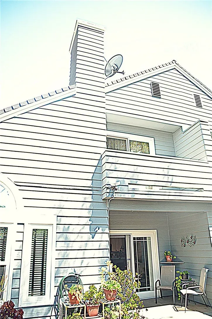 Street view. light-gray siding, sharp rooflines. I mean, cool, but maybe too sharp?