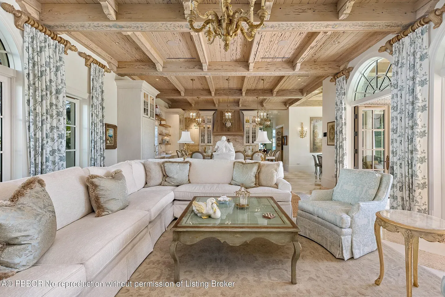 Big L-shaped couch begging for naps. Pale blues keep it calm.