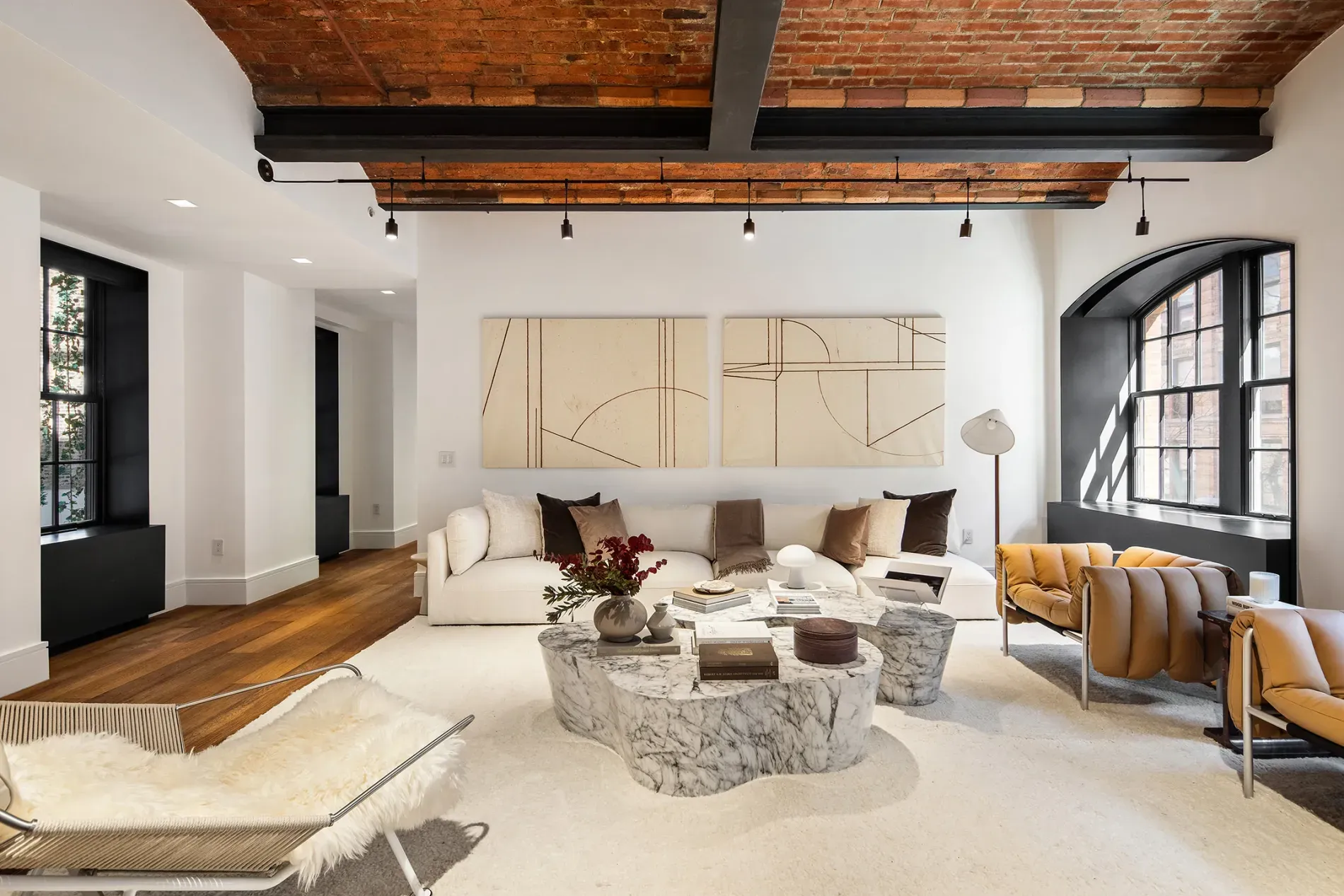Here's the living room—brick ceiling and beams. Marble coffee table kinda steals it.