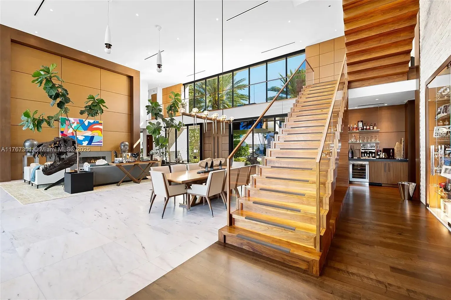 Open living area. Huge windows, warm wood, everything looks easy to breathe in.