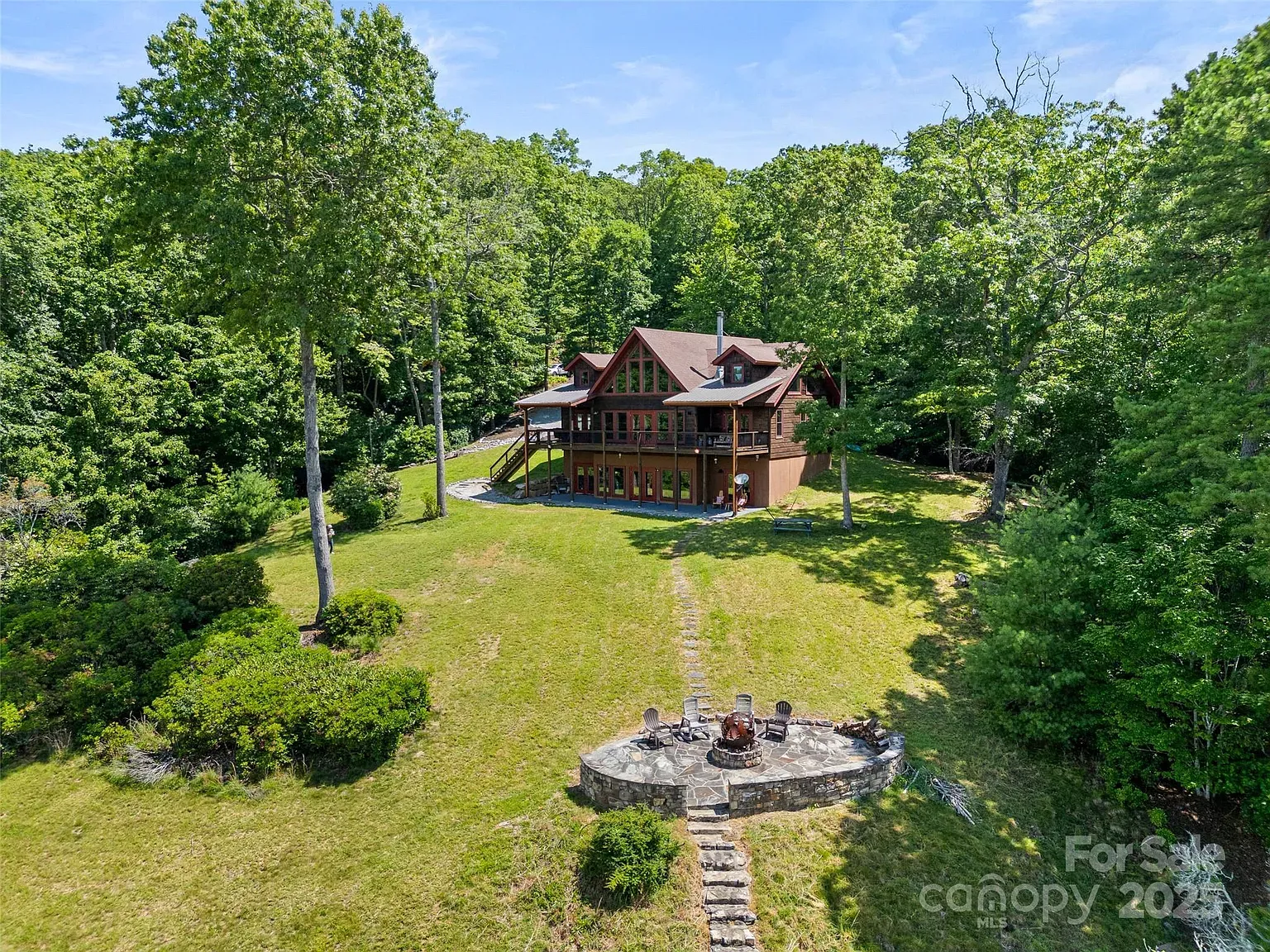 Tucked among big pines, the wood siding basically disappears into the forest.