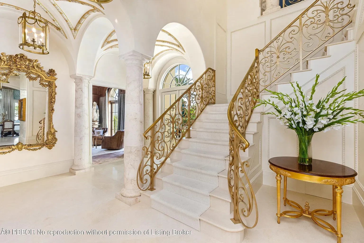 Shot from halfway up—the spiral railing is wild. Marble’s blinding.