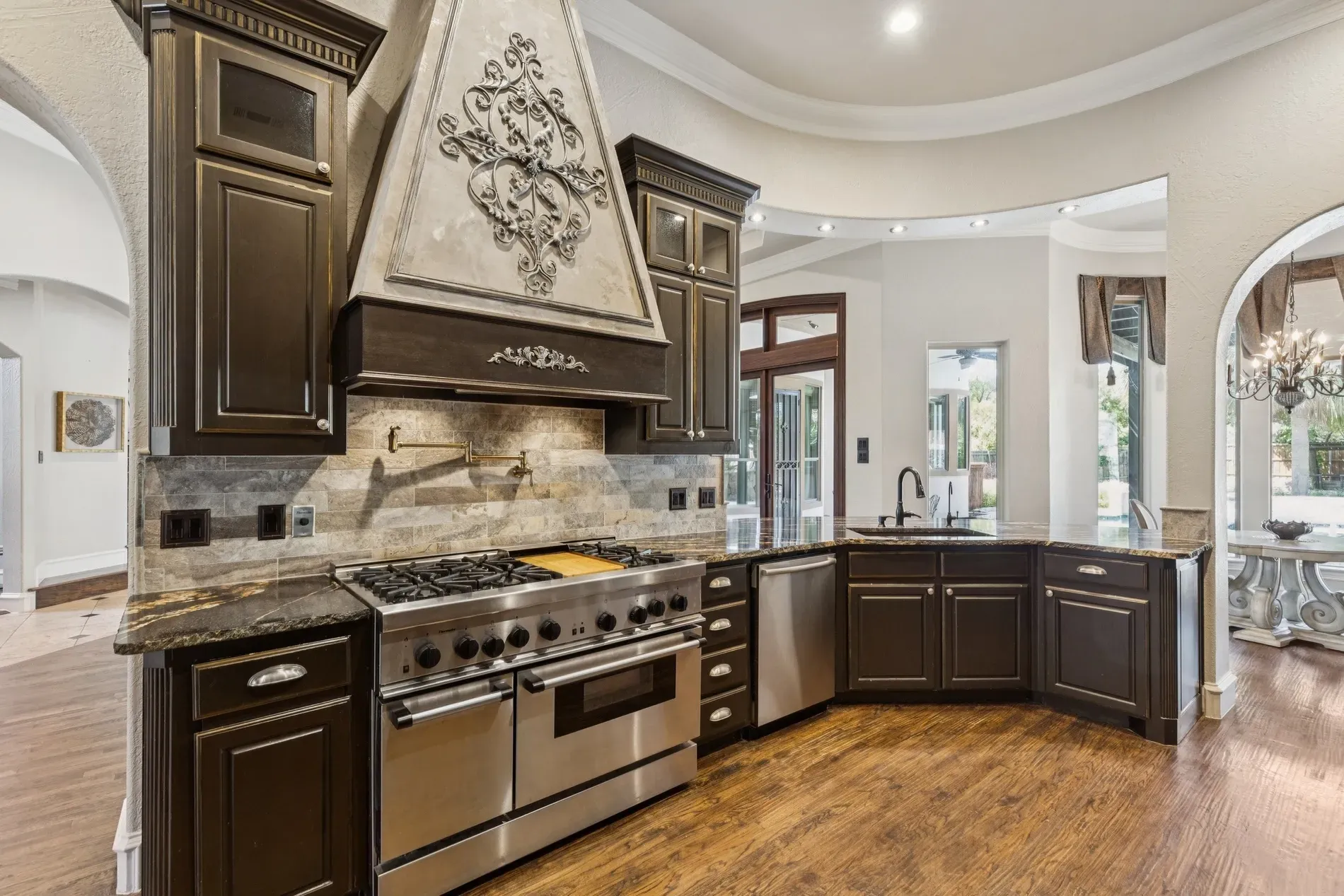 Okay, this hood — triangular crown over the range. Not sure, dramatic but cool.