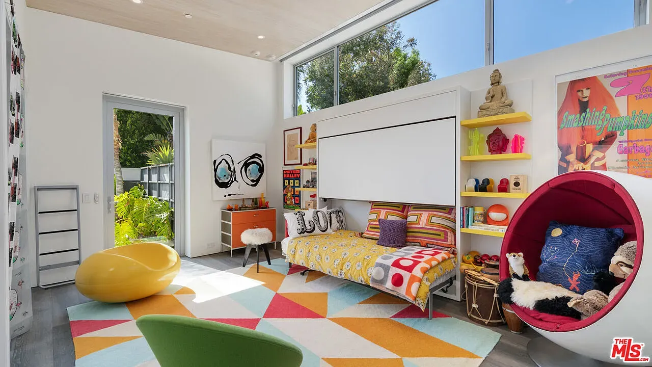 That rug is yelling in the best way. Playful colors everywhere.