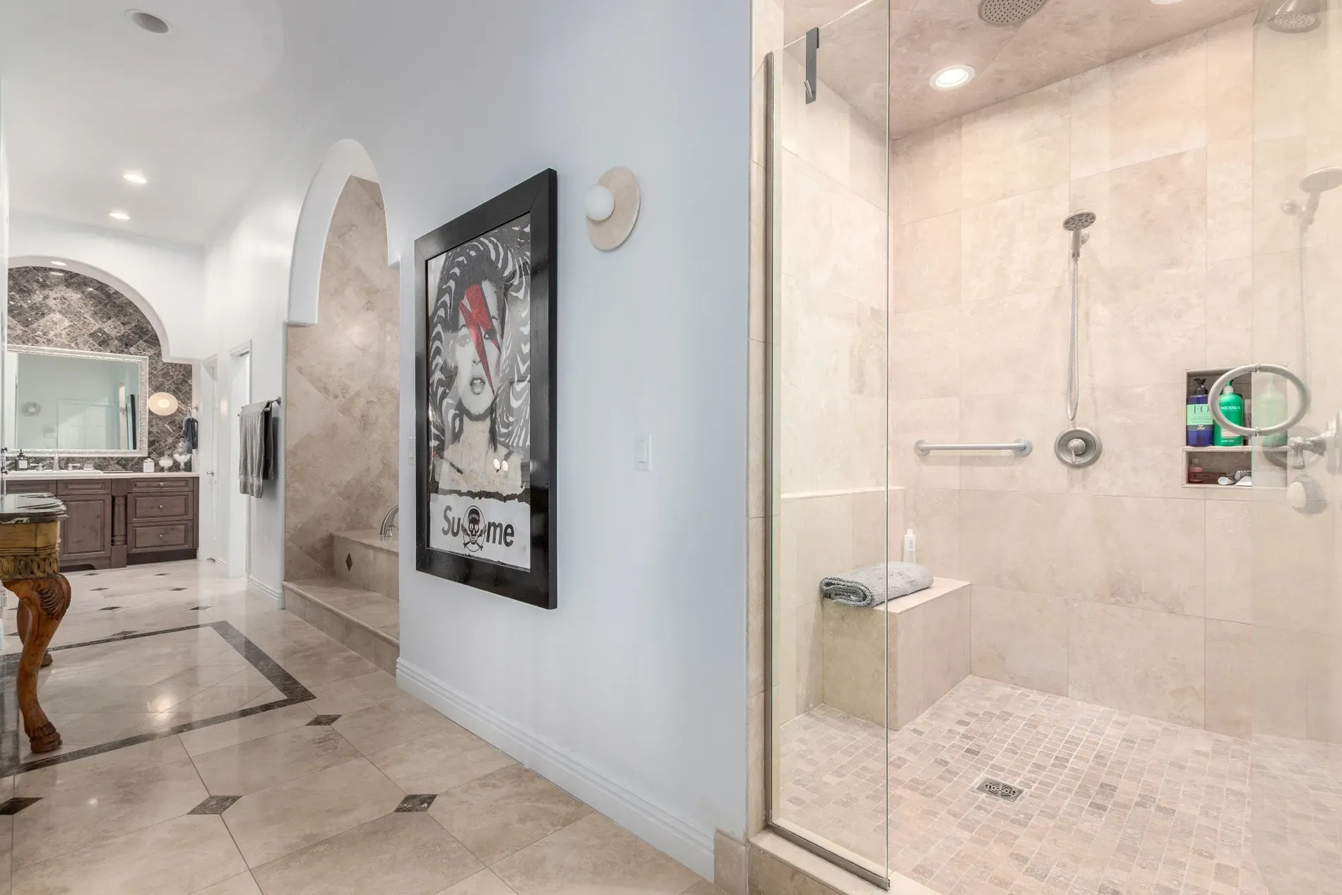 Bathroom’s arches are pretty. Beige travertine everywhere — I mean, too matchy?