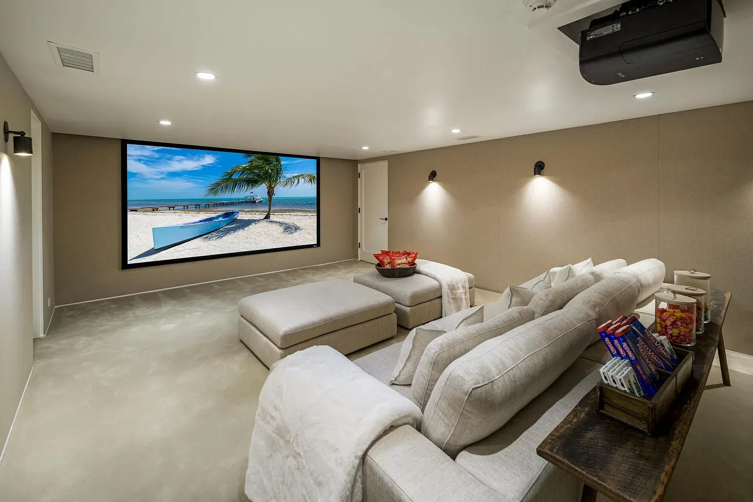 Movie room that wants you to nap mid-film. Those fabric walls look plush.