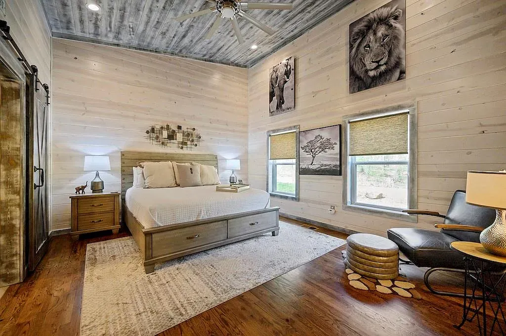 Shiplap bedroom with calm colors and big windows. Easy place to sleep.