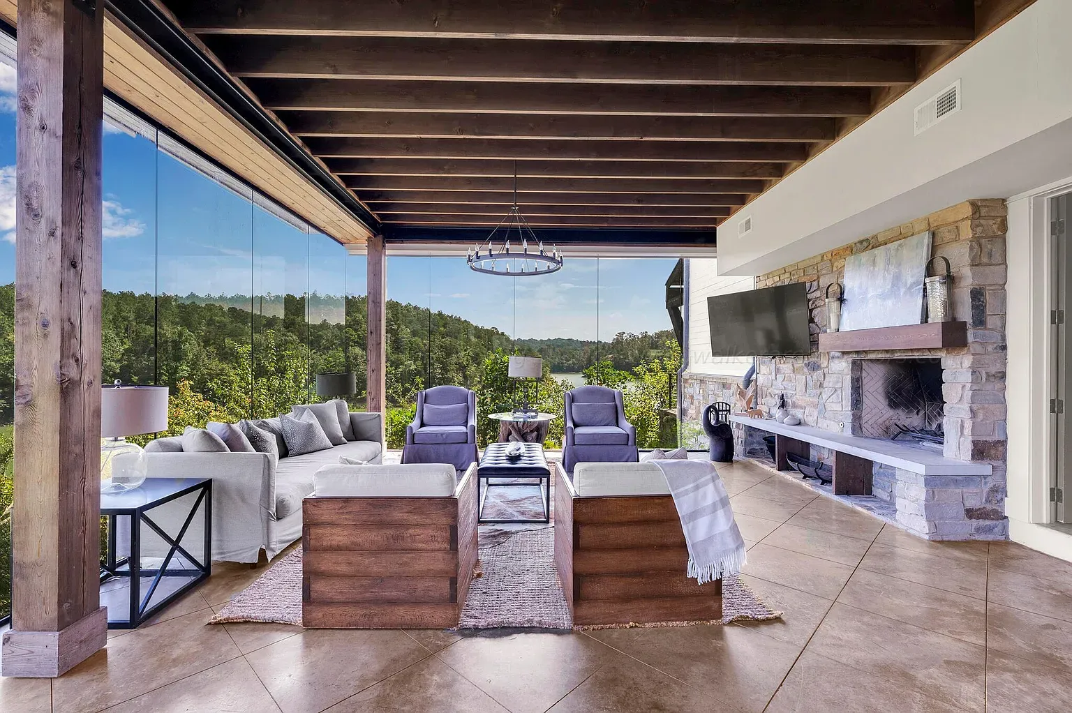 Glassed-in lounge with wood beams. Sit here during storms and just watch.