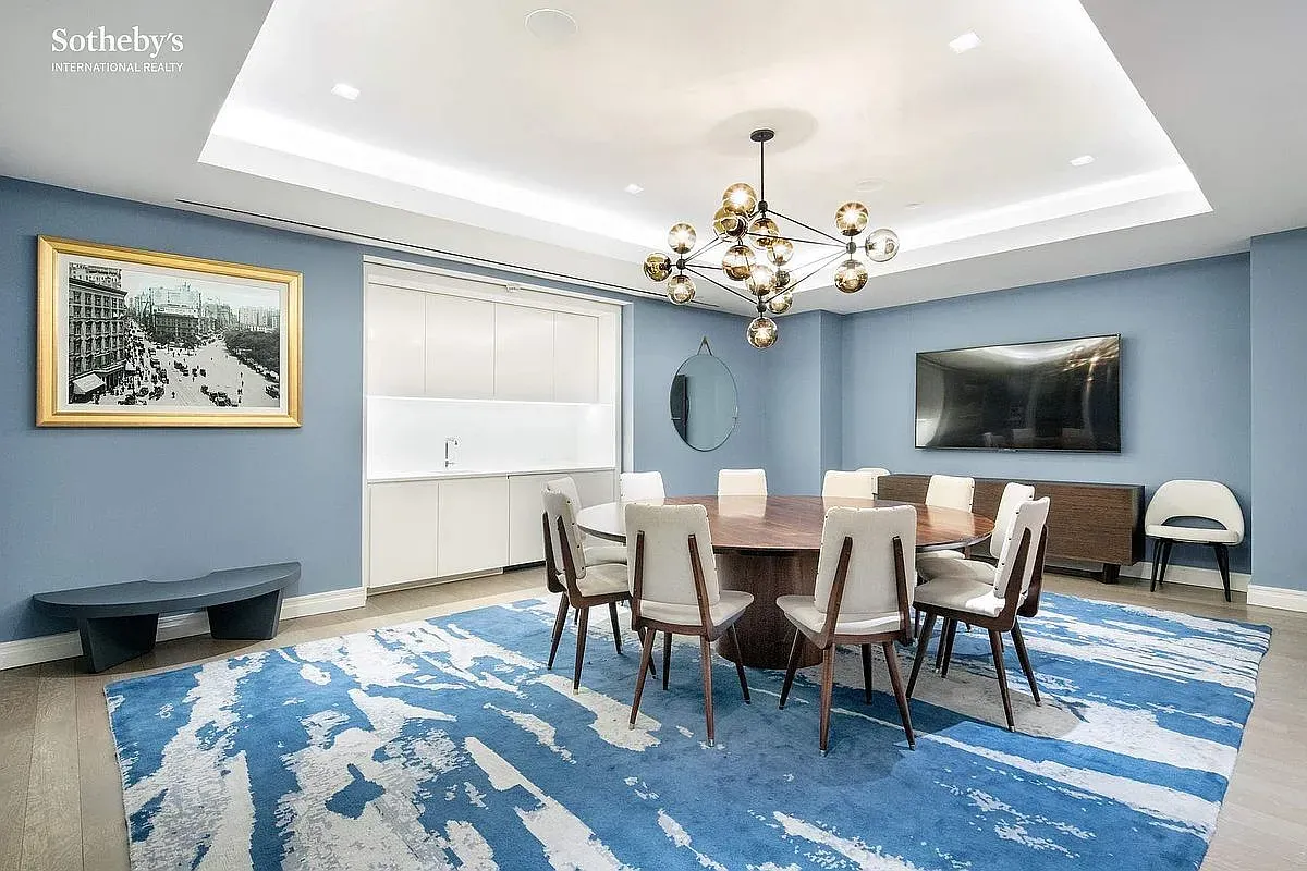 Light blue dining, big round table. Feels calm, conversation-friendly, no bad seats.