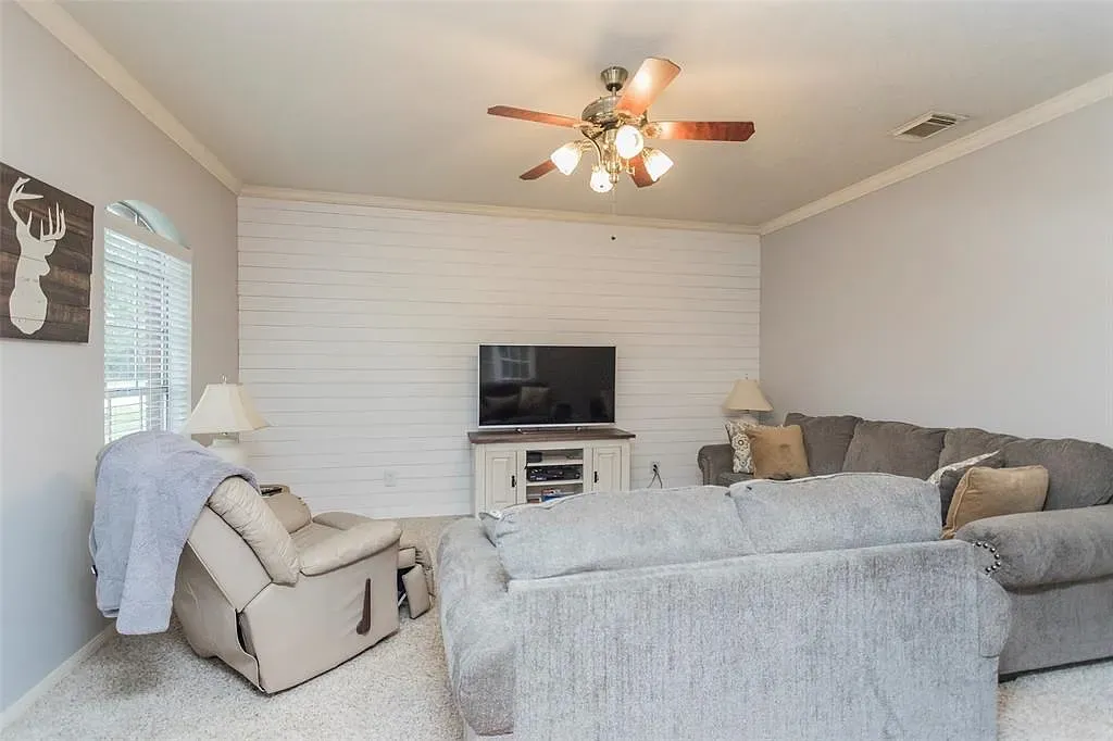 Neutral living room with shiplap accent wall. Soft, bright, very couch friendly.