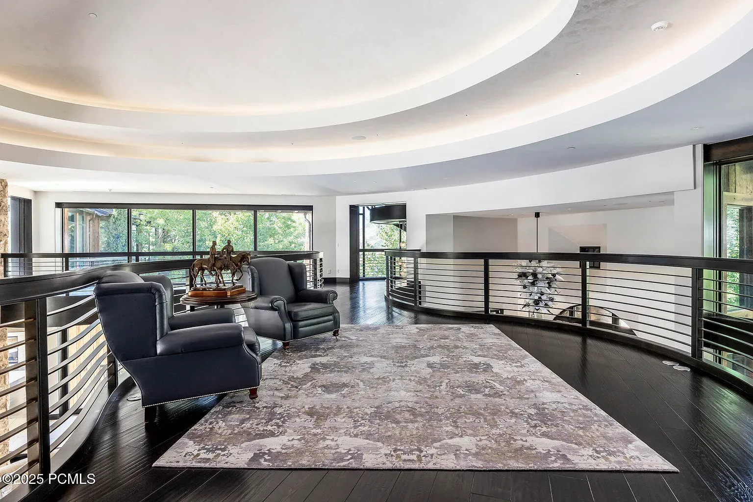 Wide shot shows that ceiling detail. Dark floors, warm lights, very gallery vibes.