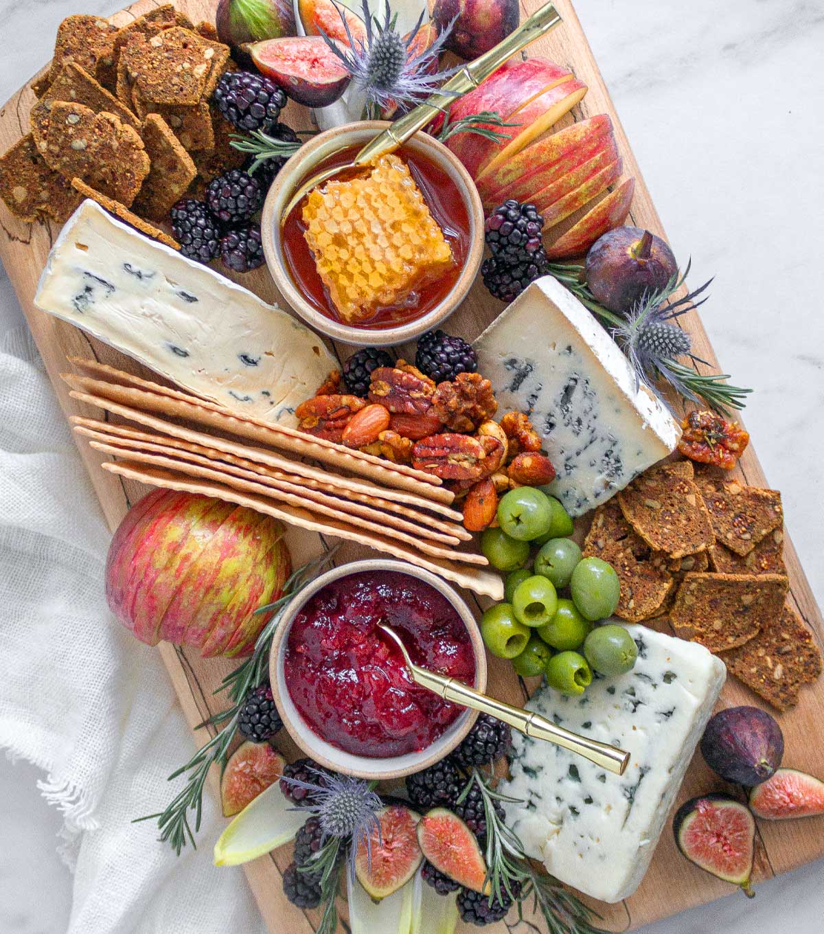 a cheese board with blue cheese