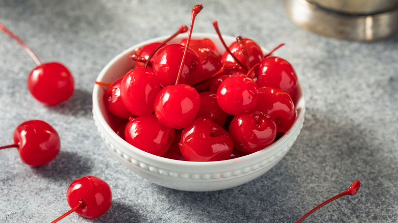 a bright bowl with maraschino cherries