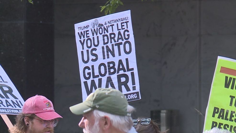 Veterans holding signs at protest