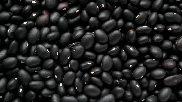 a close-up photo with twenty-seven black beans