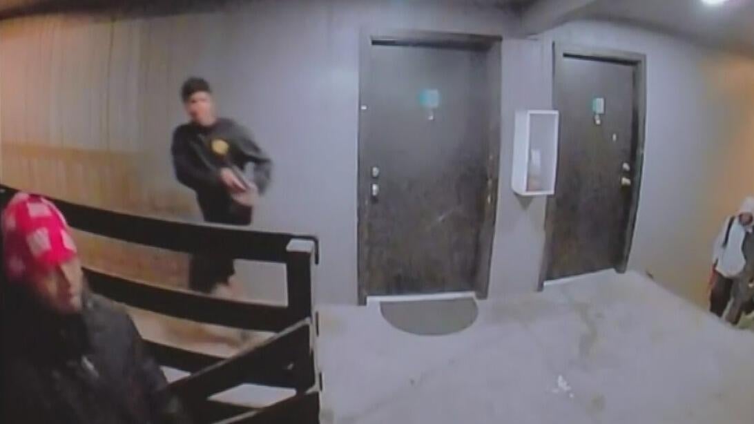 Aurora police release video of suspected gang members aiming guns inside apartment complex