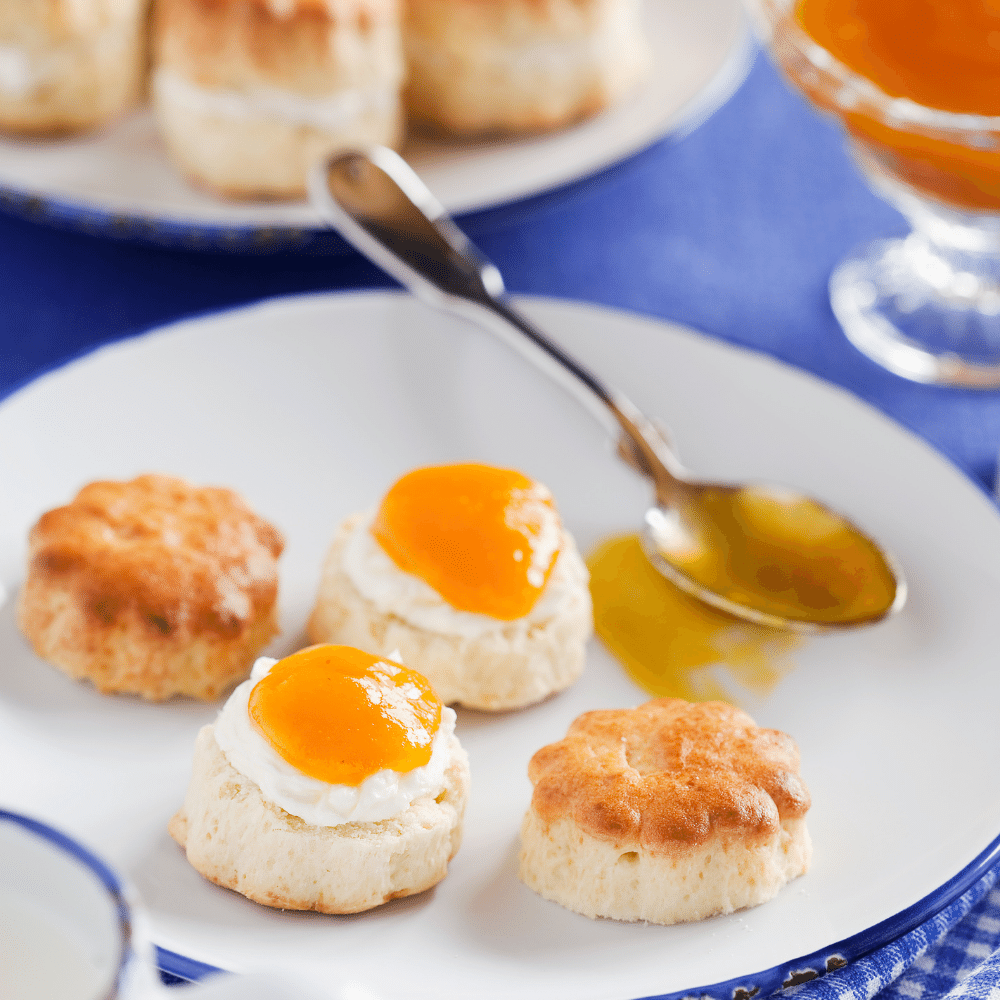 Spreading Peach Preserves on Scones