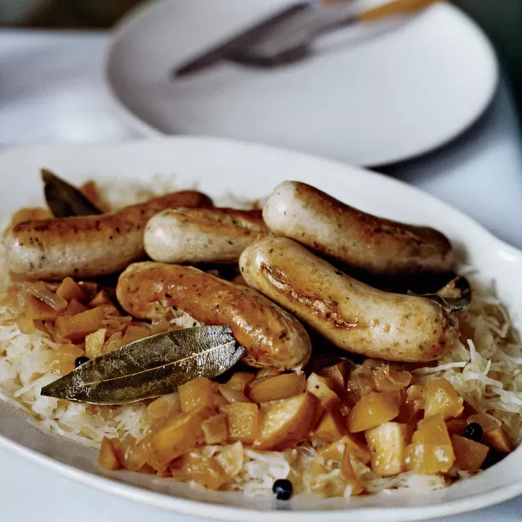 Sautéed German Sausages with Bacon and Apple Sauerkraut