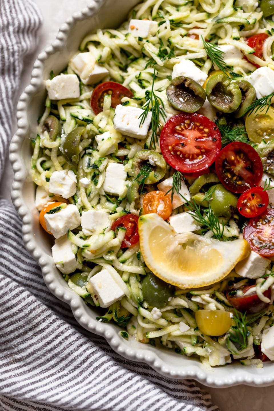 Lemony Grated Zucchini Salad with Tomatoes, Olives & Feta