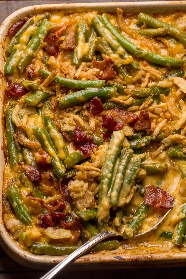 roasted green beans with crispy bacon bits in a casserole dish