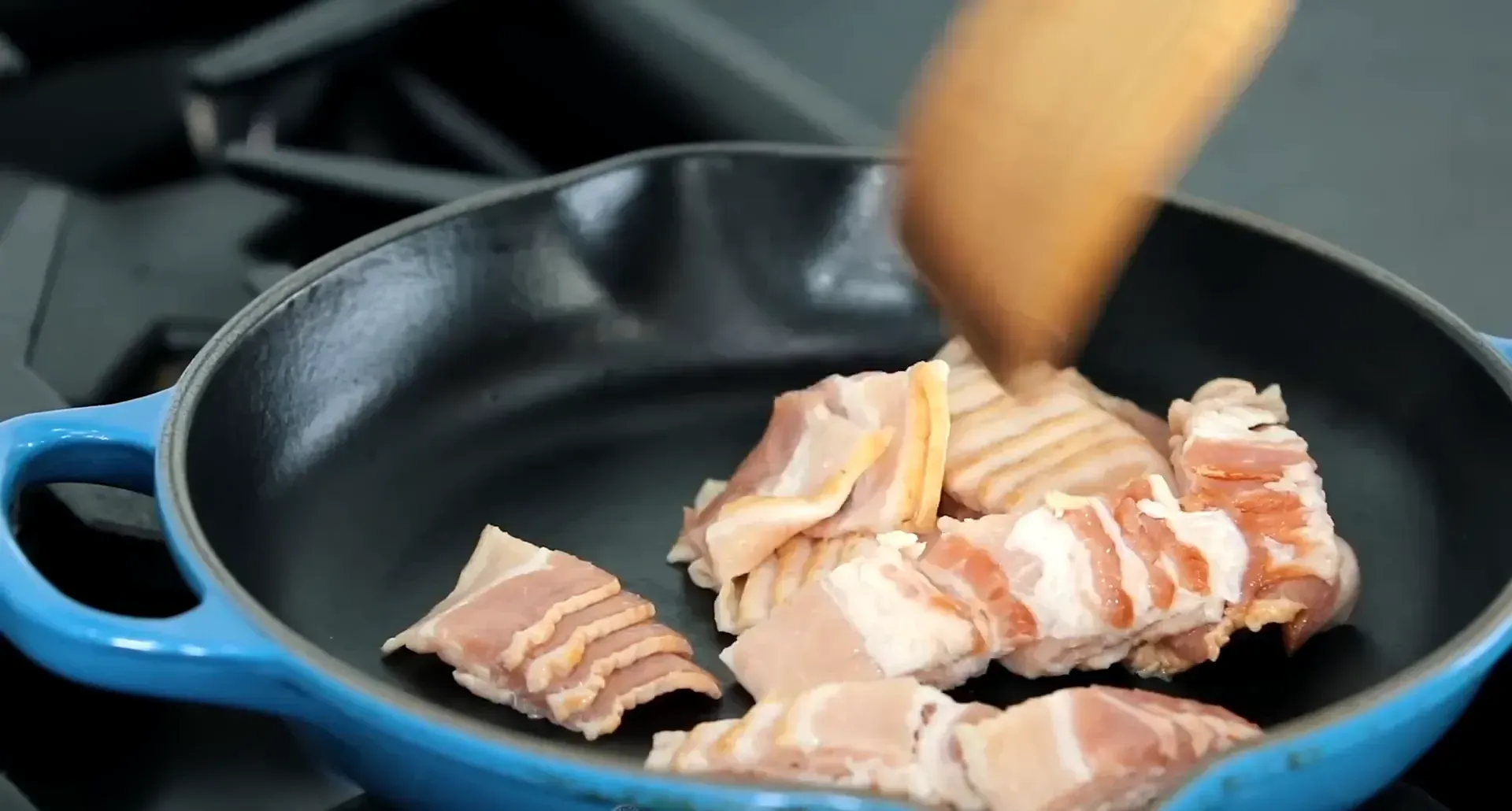 Bacon sizzling in the pan.
