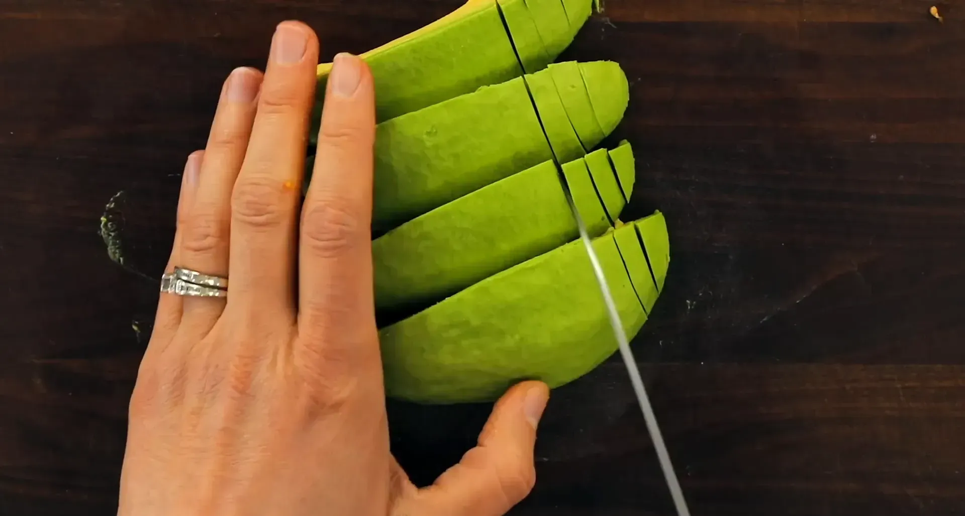 Cutting an avocado.