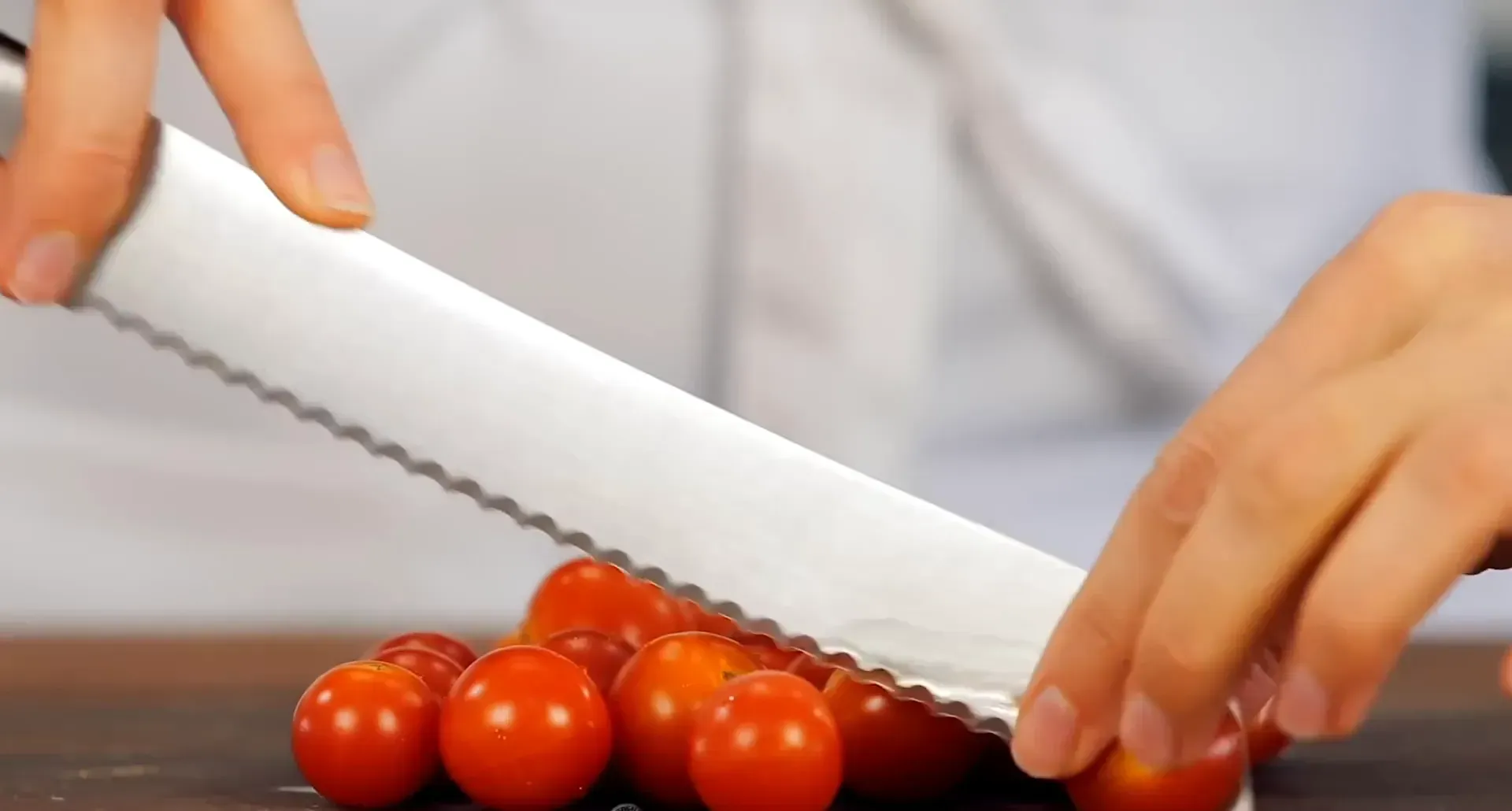 Halving cherry tomatoes.