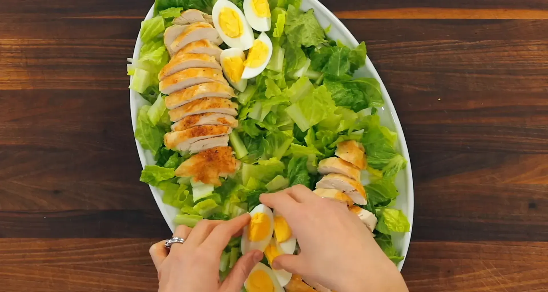 Eggs arranged on the salad.
