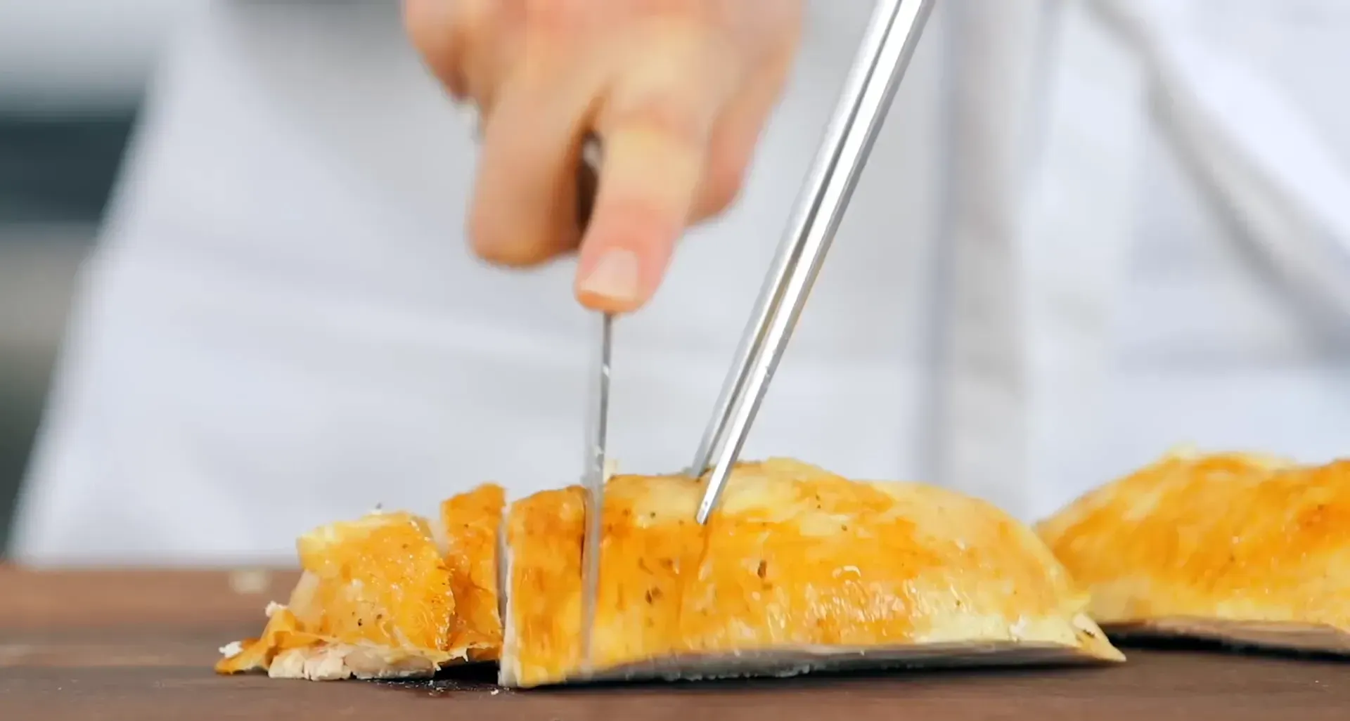 Slicing chicken breasts.